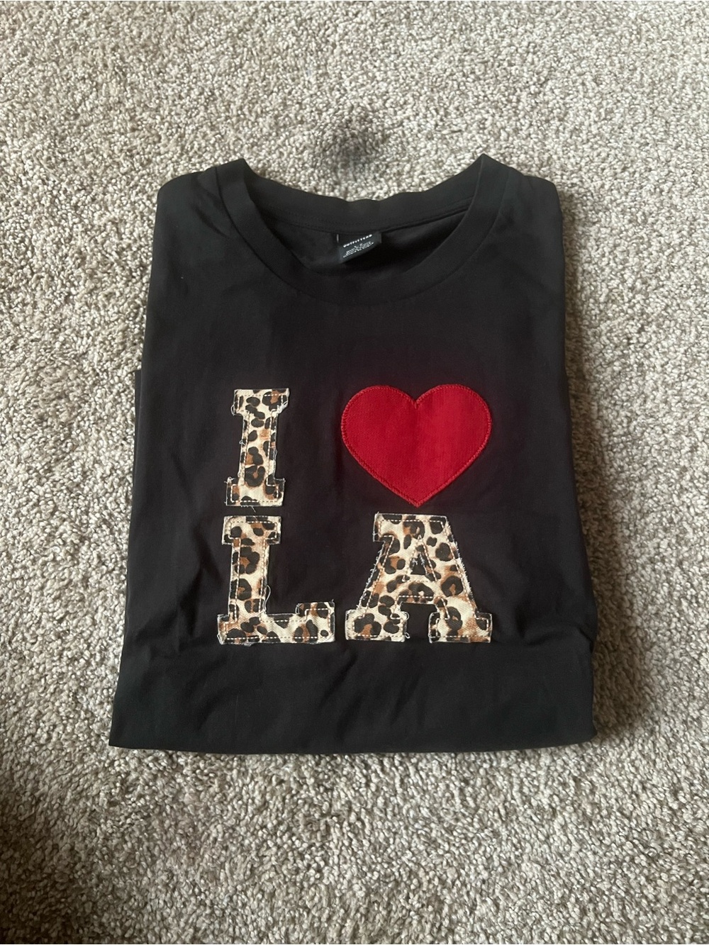 Urban Outfitters Black Graphic Tee with Leopard Heart Accent